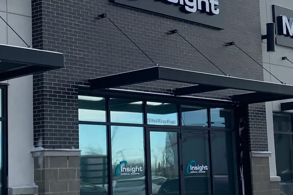 Dark brick storefront in snow